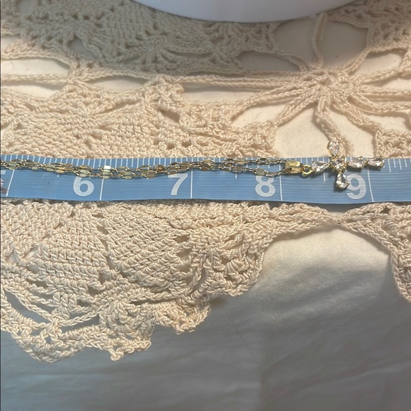 Elegant Gold and Crystal Cross Pendant Necklace - Picture 3 of 9